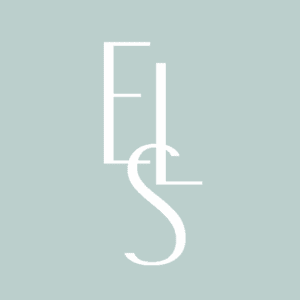 Eye Love Spearfish logo: three elegant white letters ‘E’, ‘L’, and ‘S’ interwoven on a soft teal background, forming a stylized monogram for the optometry boutique.