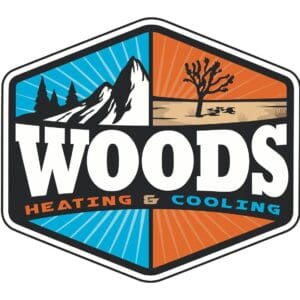 Woods Heating & Cooling logo featuring a bold mountain and desert design with trees, sun rays, and the company name in large block letters; warm and cool colors representing heating and cooling services.