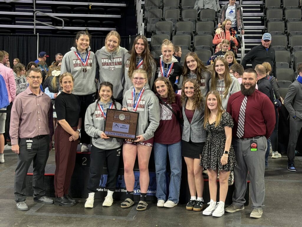 Spearfish Girls Wrestling Team holding their 3rd Place Trophy at the 2026 Class A Wrestling Tournament in Sioux Falls.