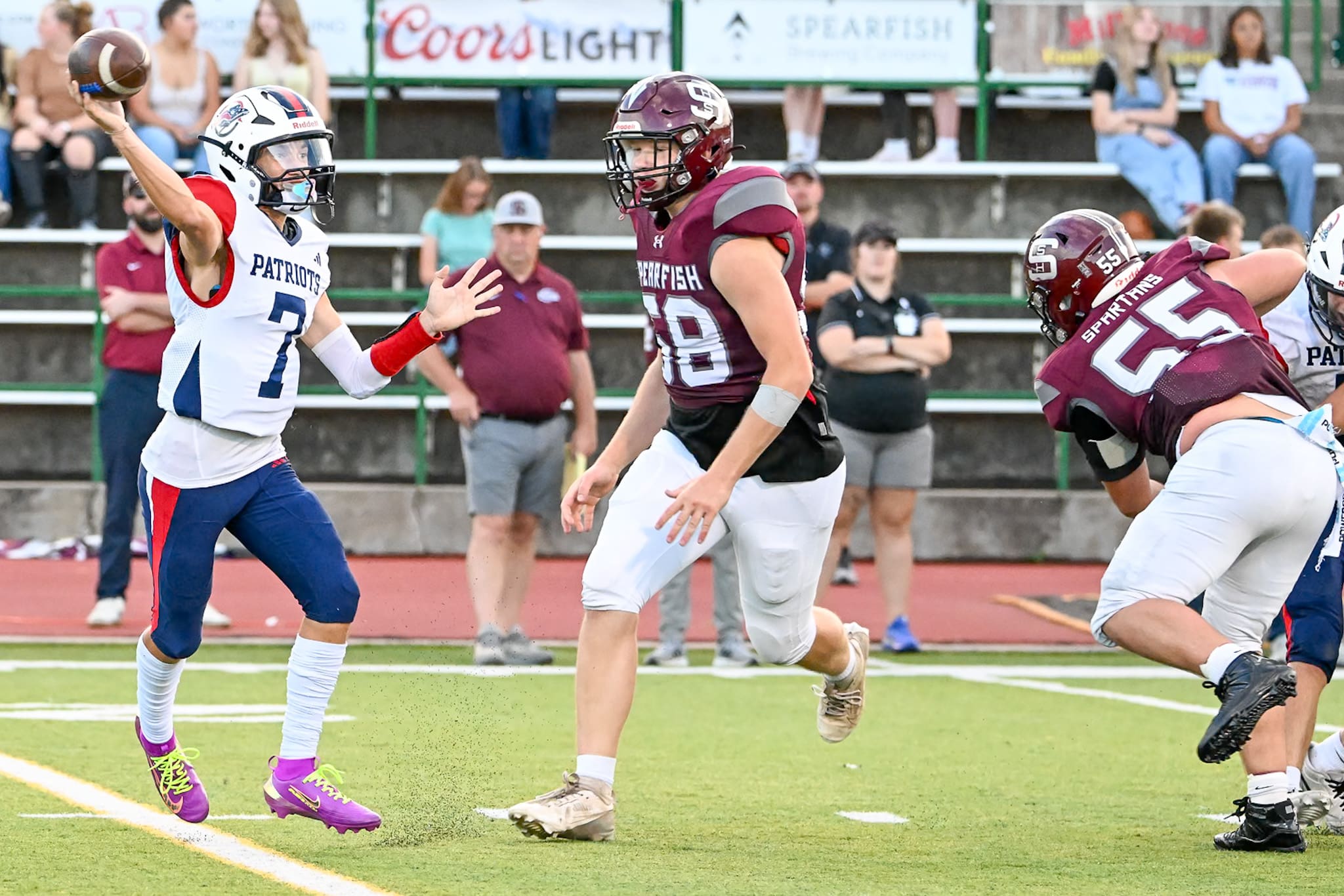 Ethan Foote and Ziah Torpy of the Spearfish Spartans Football team put pressure on Douglas Patriots Quarterback Jack Coper in the Spartans 66-7 win over the Patriots at Lyle Hare Stadium on Friday, September 18.