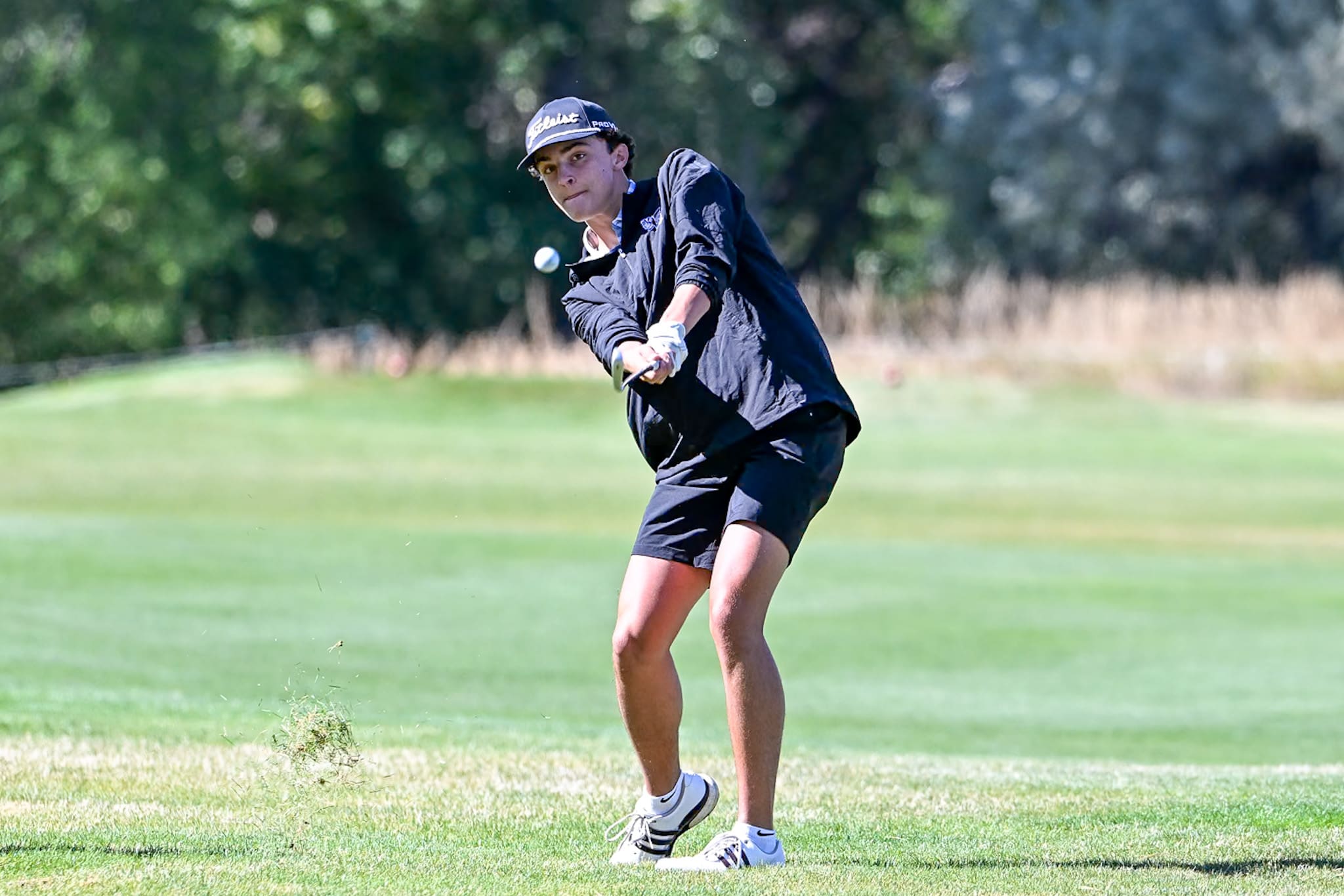 Cade Larscheid of the Spearfish Boys Golf Team hits a golf ball at the Spearfish Invitational Golf Meet in Spearfish on Tuesday, September 15, 2026.