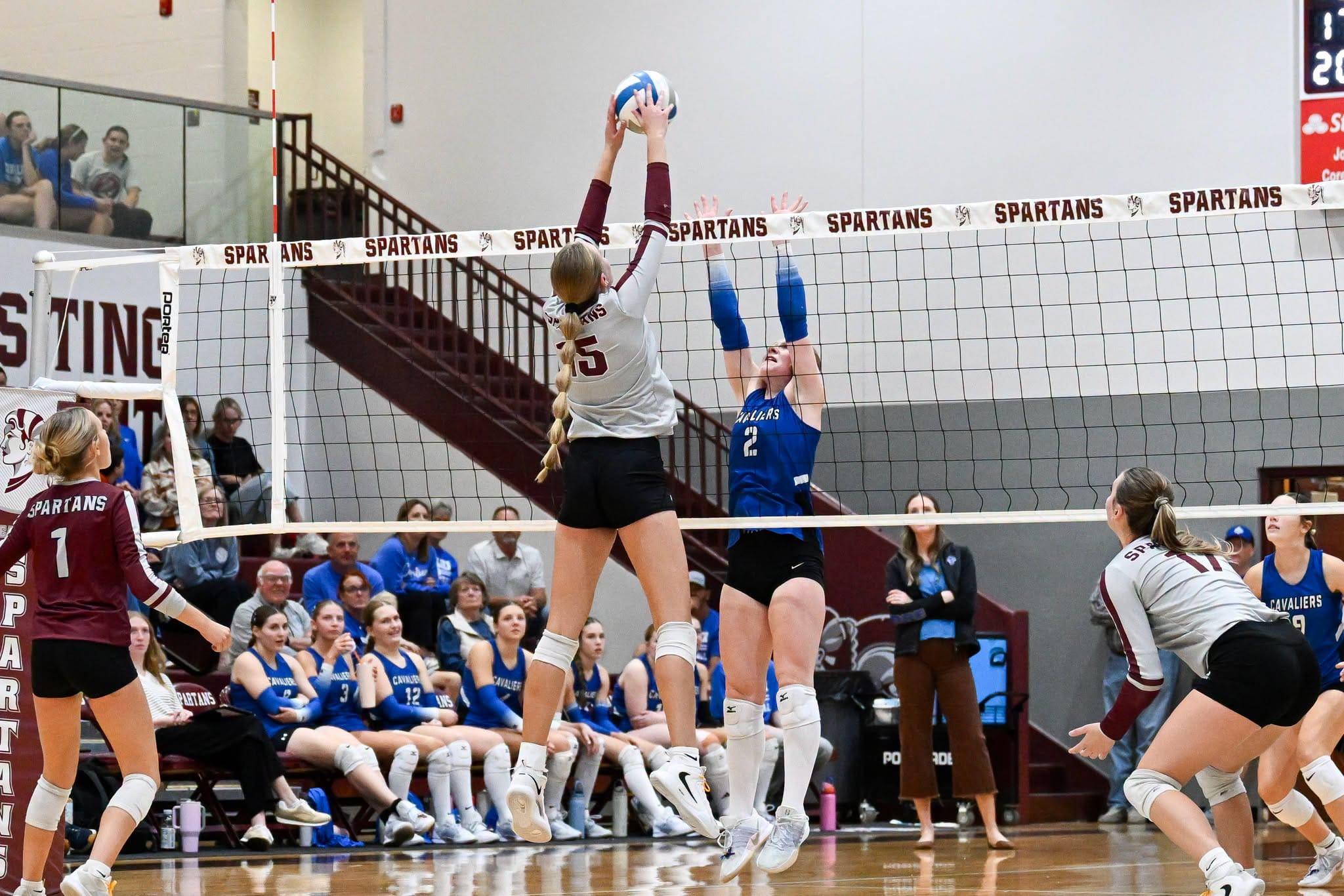 Julie Billington of the Spearfish Spartans Volleyball Team goes up for a block against the St. Thomas More Cavaliers on Tuesday, September 29 at Spearfish High School.