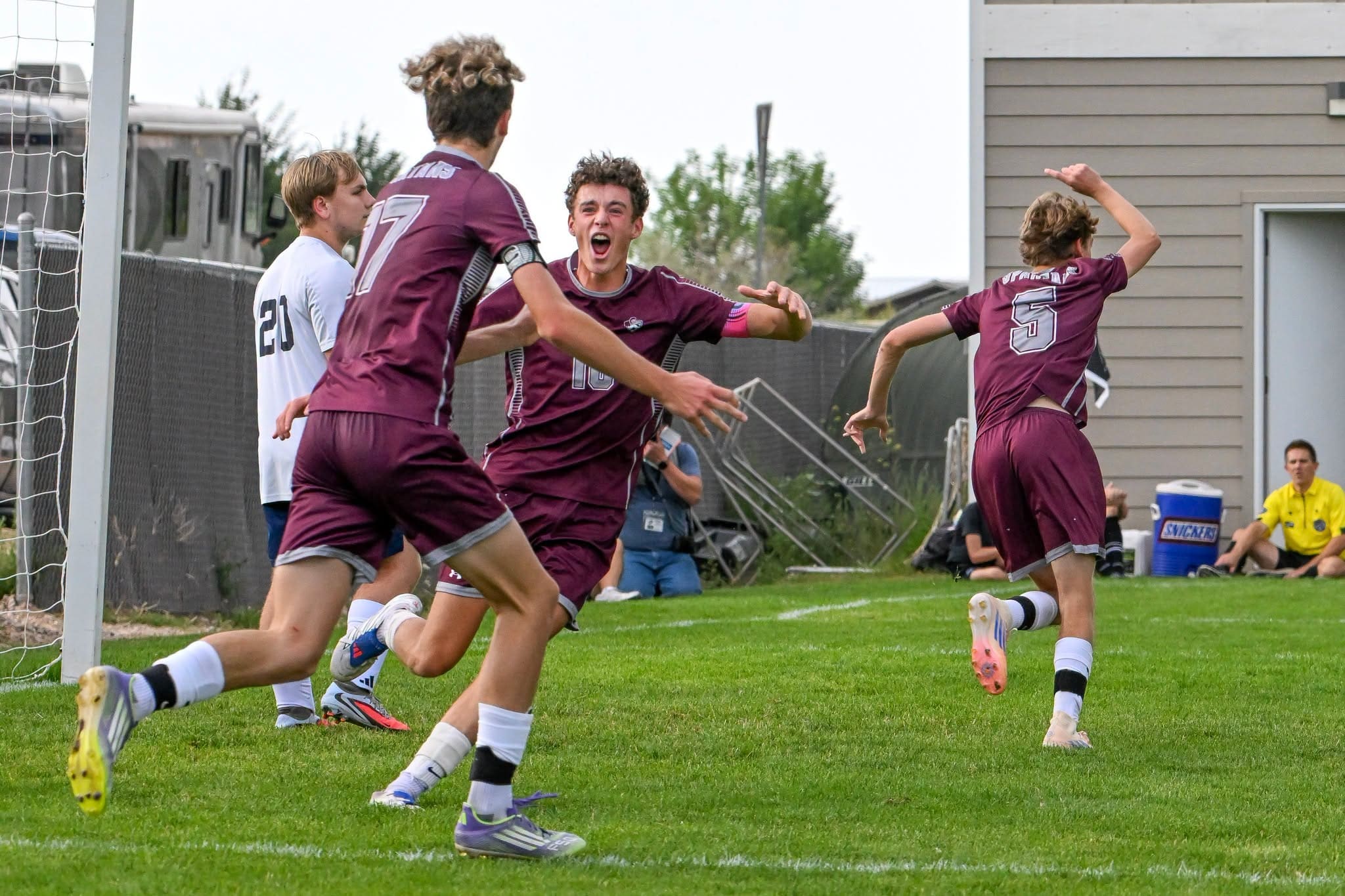 Jaxon Skvicalo, Evan Duncan and Brooks Meyer of the Spearfish Spartans Boys Soccer Team celebrate a goal vs. Tea Area in the Spartans win at the Black Hills Power Sports Complex on August 14, 2026.