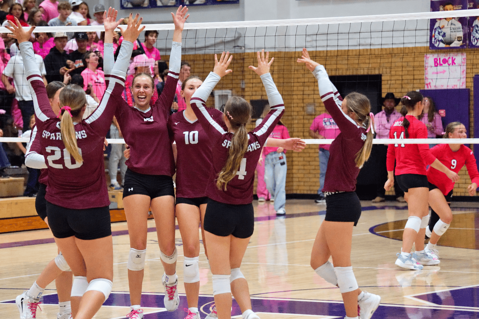 Members of the Spearfish Spartans Volleyball team celebrate a point during the team's matchup against the Belle Fourche Broncs on Tuesday, October 13 at Belle Fourche High School.