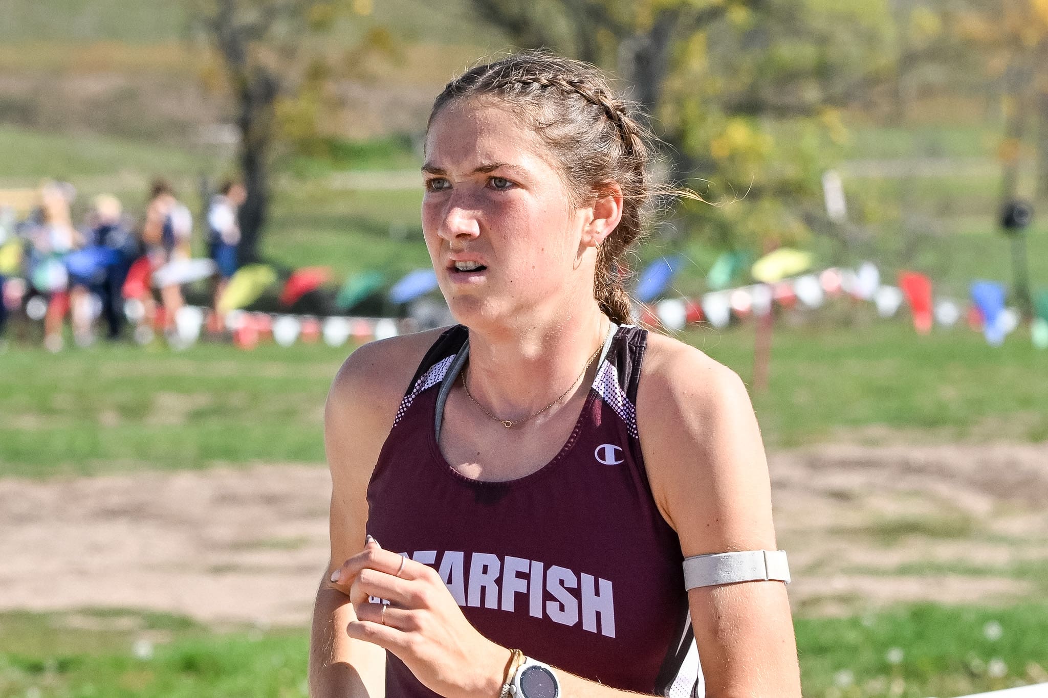 Peyton VanDeest crosses the finish line at the Black Hills Conference Cross Country Meet in Rapid City at the Hart Ranch Resort.