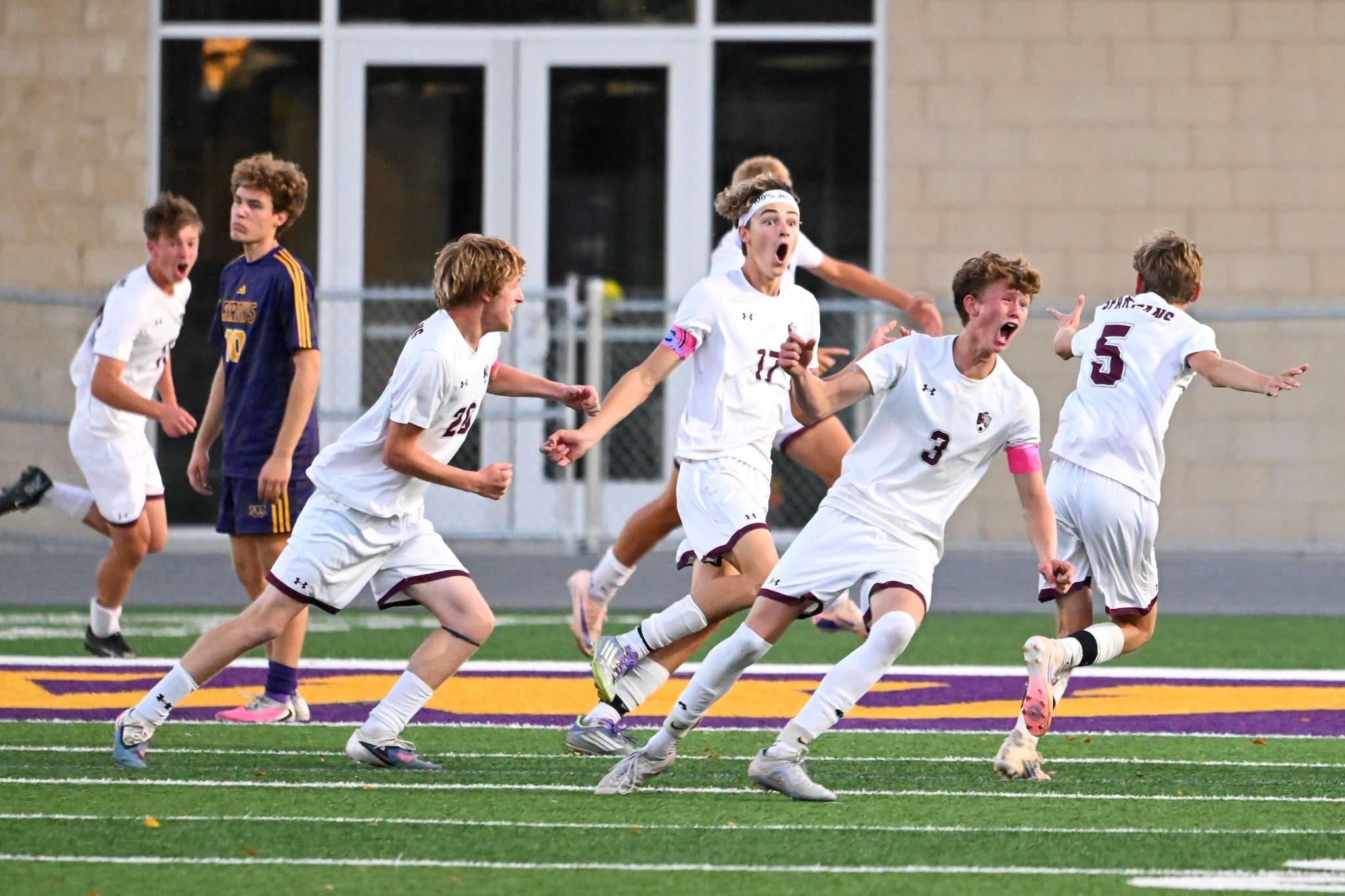 The Spearfish Spartans Boys Soccer team celebrates after scoring a goal against the Watertown Arrows during the Class AA State Quarterfinal matchup in Watertown, SD.